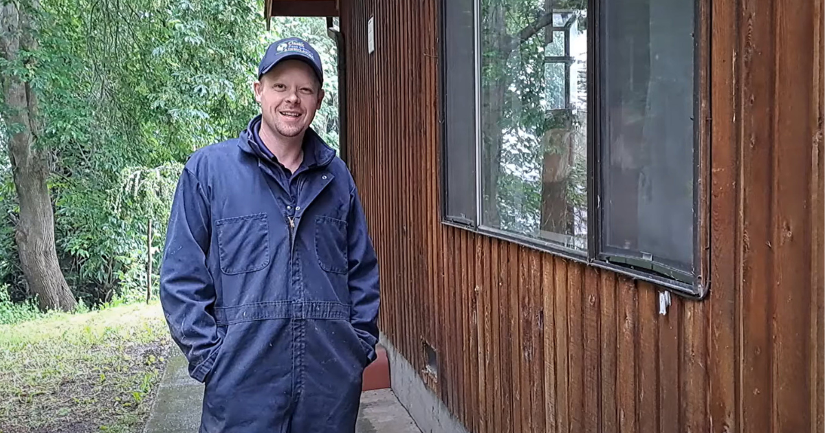 When to Hire an Exterminator - friendly pest control technician from Classic Pest Control & Insulation standing outside a home in Washington state